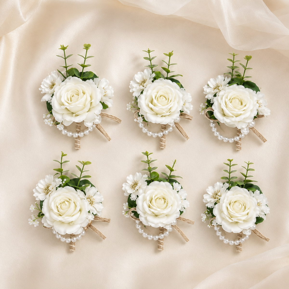 Six white rose wrist corsages with pearl bracelets arranged in rows