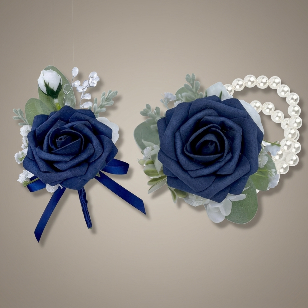 Navy blue rose boutonniere and matching wrist corsage with pearl bracelet on a neutral background