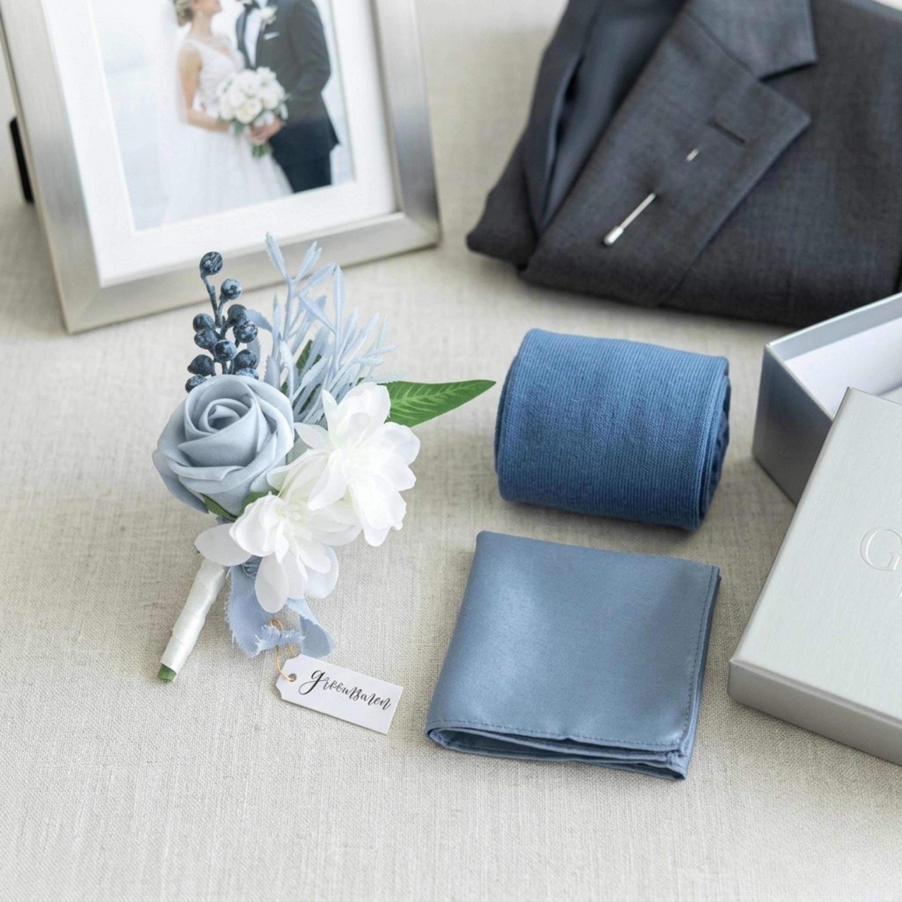 Additional view of dusty blue wedding boutonniere set of two for groom and groomsmen