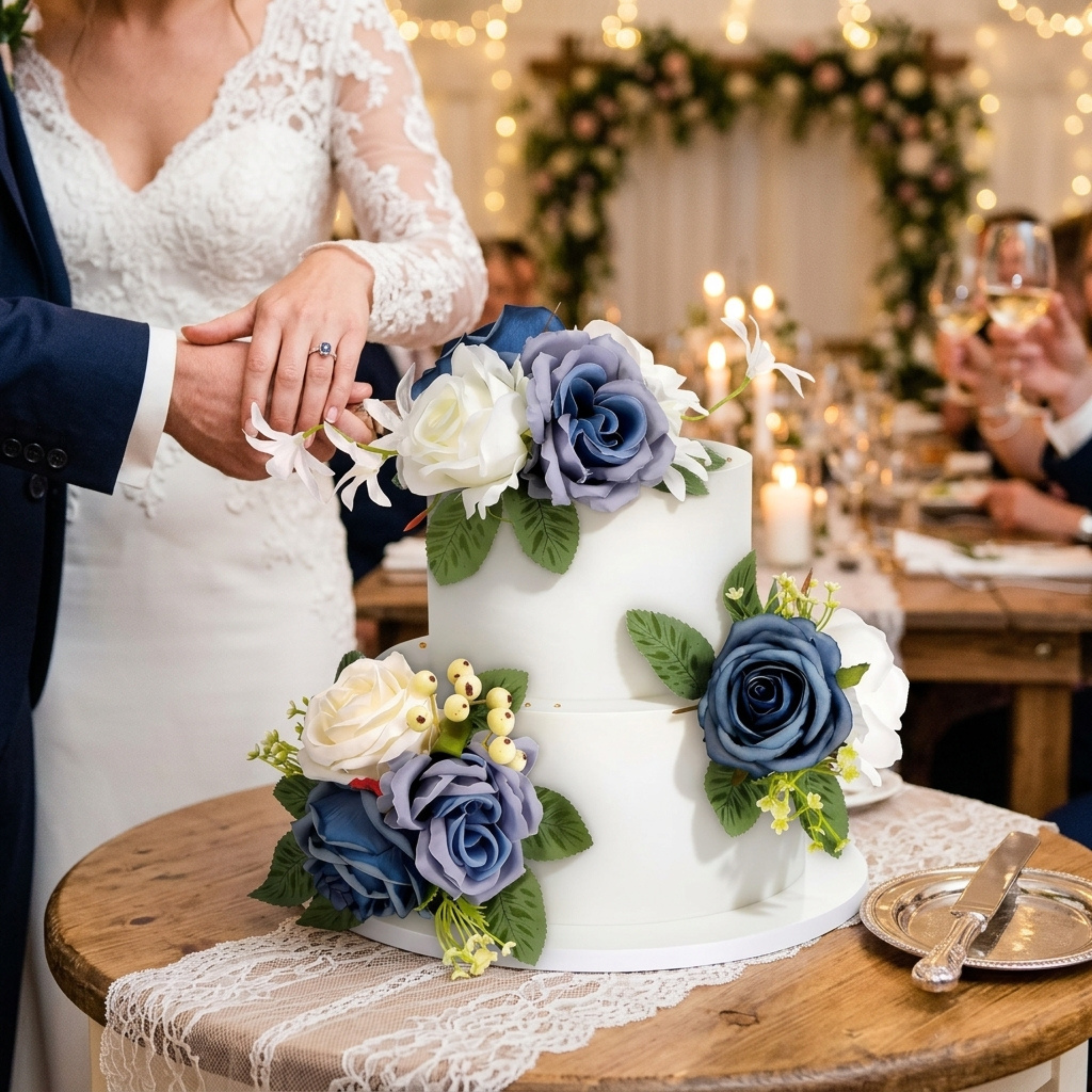 Couple cutting elegant wedding cake with premade blue and white floral cake topper set