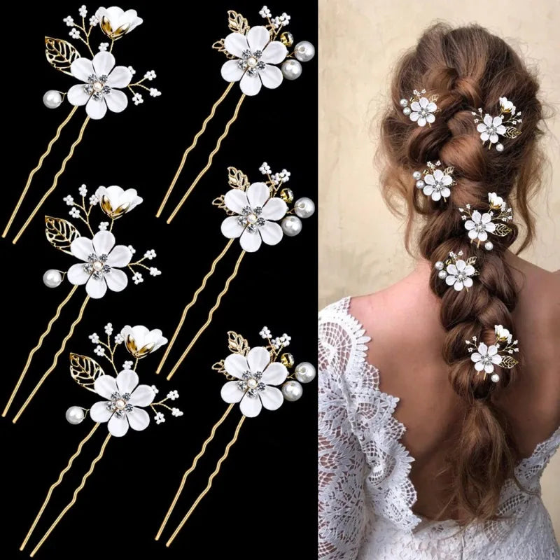 Six gold bridal hair pins with white flowers and pearls beside a long braid decorated with the pins