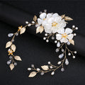 Gold bridal hair vine with large pearly white flowers, faux pearls, clear beads and gold leaves