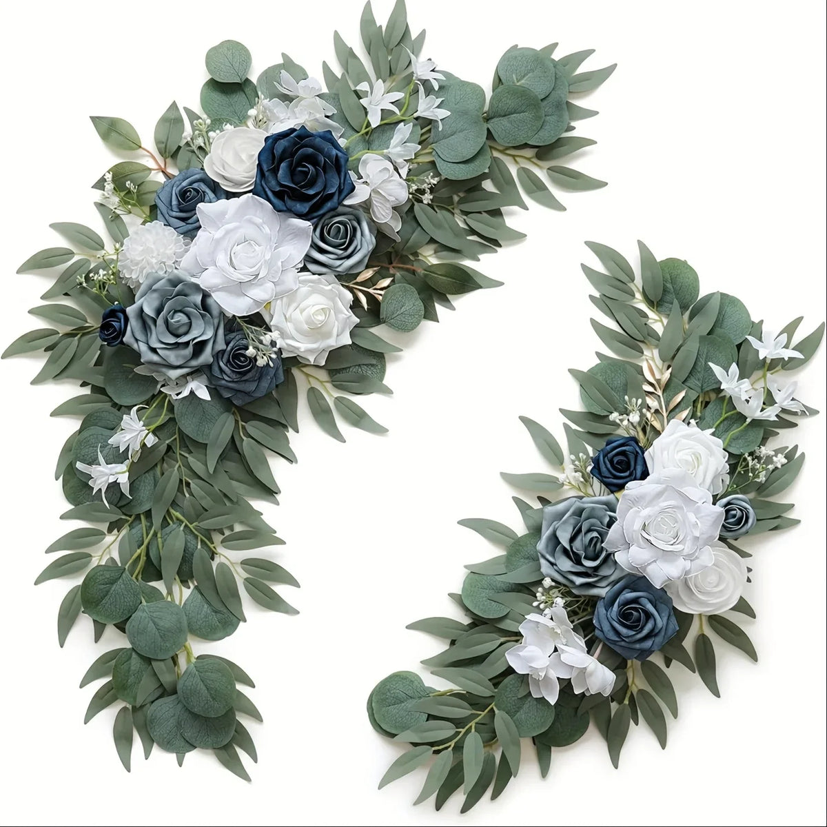 Two artificial floral swags with navy, dusty blue and white roses and eucalyptus greenery on white