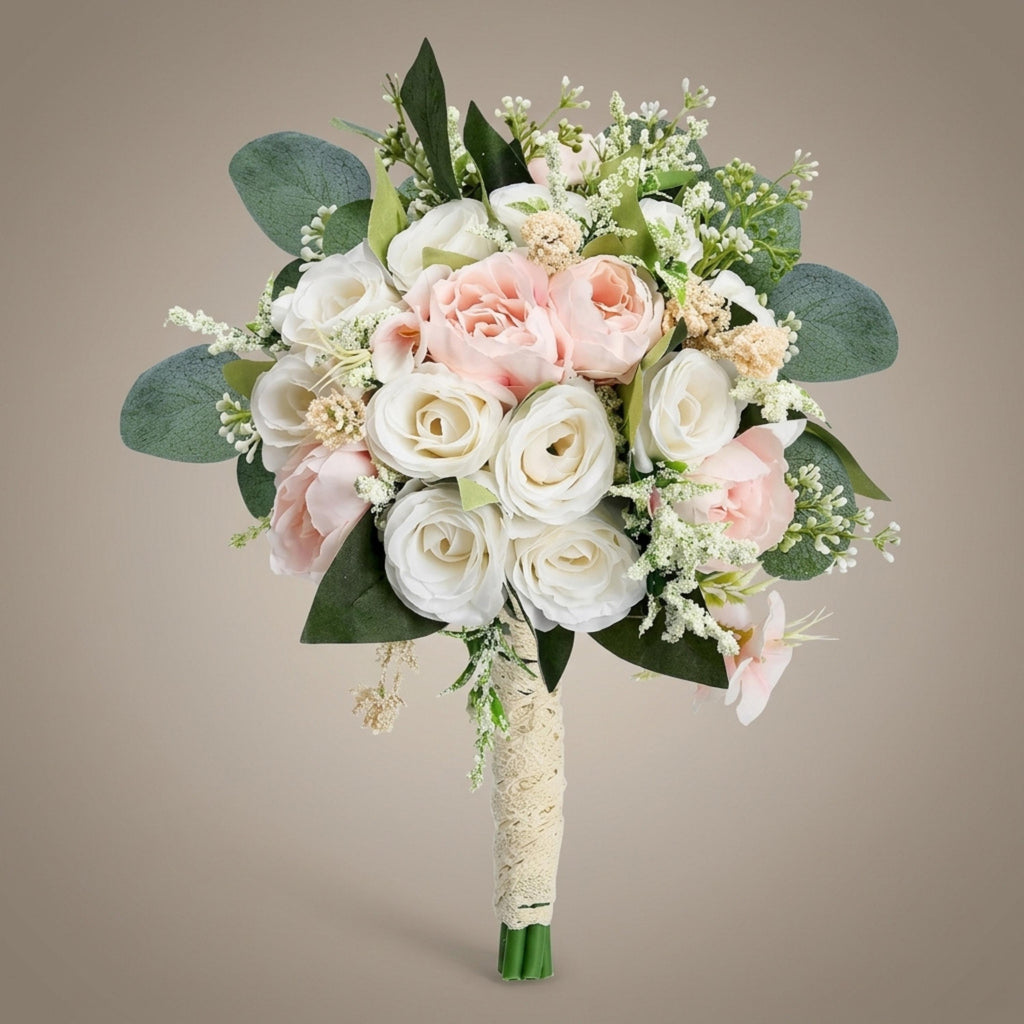 Blush and ivory silk rose bridesmaid bouquet with eucalyptus leaves and a cream wrapped handle